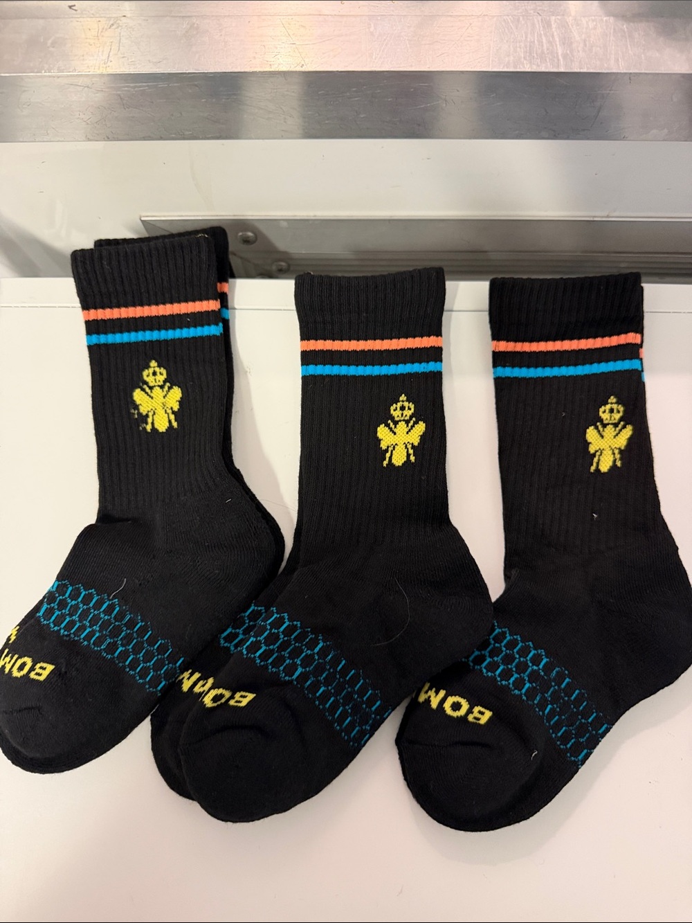 Bombas Black Crew Socks with Yellow Crest and Blue & Orange Stripes 3 pair
